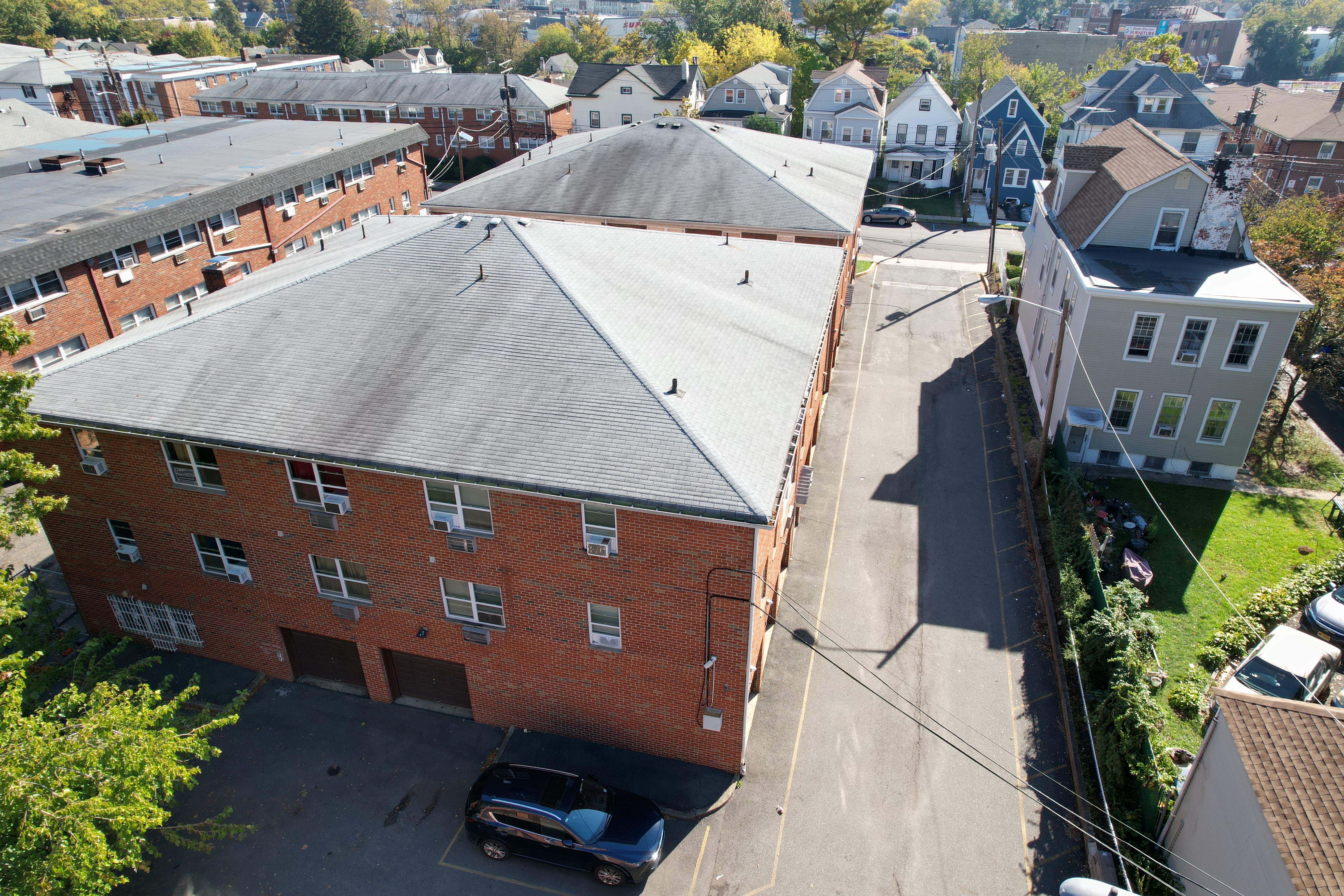 Drone view of Myrlin Apartments and parking
